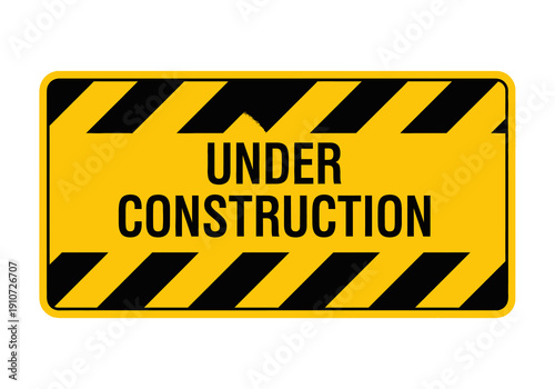 A bright yellow rectangular sign with black diagonal stripes indicating 'UNDER CONSTRUCTION' in bold black letters.