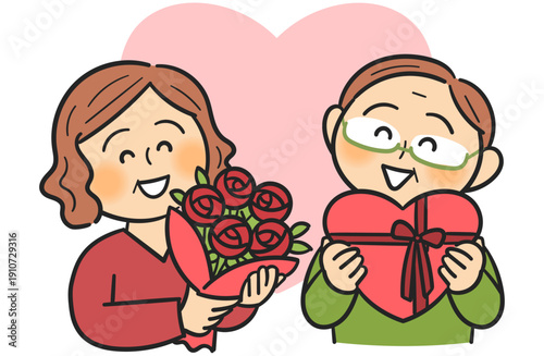 バレンタインにプレゼント交換をして喜ぶ笑顔のシニア夫婦