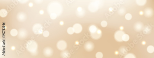 Soft, elegant beige background with a dreamy bokeh effect with shimmering light circles and warm glowing sparks