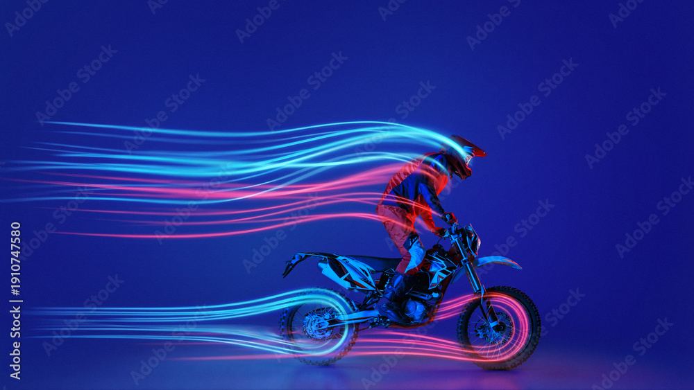 Fototapeta premium Dynamic artwork. Motocross rider with neon light trails on blue background. Concept of extreme sports advertising, motorsport branding visuals, and speed performance campaigns.