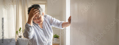 Bilde på lerret Aged woman feel dizzy and headache at home.