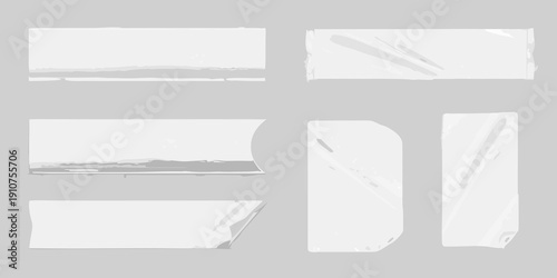 Collection of torn and ripped paper strips on a gray background