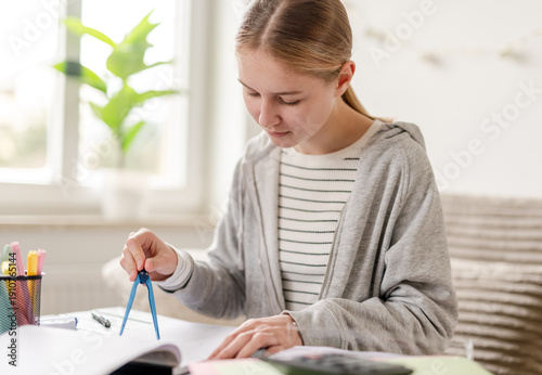 Wallpaper Mural Girl Drawing Circle With Compass As Homework At Home Torontodigital.ca