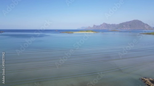 Landscape with a view of the European North Sea and Mount Hustinden in the background. Fredvang in the Lofoten Islands in Norway.