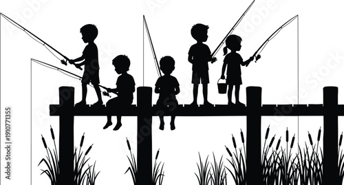 Silhouette of happy children fishing on a wooden pier with fishing rods during summer vacation at a lake with cattails plants