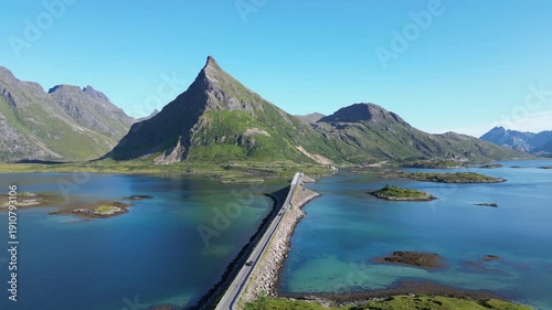 Aerial view of the Fredvang Bridges with the striking peak of Volandstind in the background. Fredvang in the Lofoten Islands in Norway.