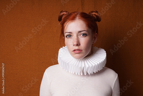 Canvas Print young woman with red space buns or odango hair style and white Elizabethan ruff
