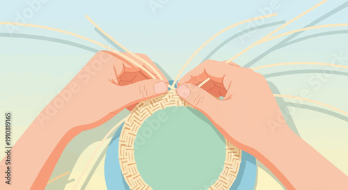 Hands weaving a textured circular object with light yellow strands