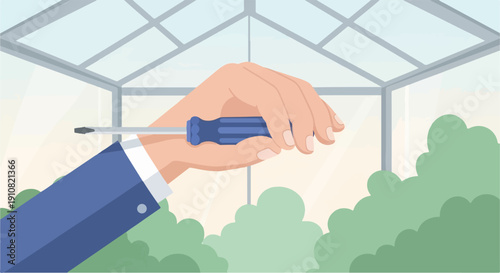 Hand holding a screwdriver inside a bright greenhouse, green foliage outside