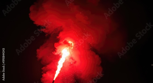 A vibrant red chemical flare burning intensely, emitting dense smoke and brilliant sparks into the dark atmosphere during a nighttime celebration or signal ,texture ,hot ,rescue