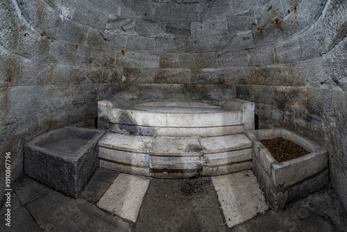 Stone bed inside domed Thracian Tumulus at Mezek, an ancient tomb.