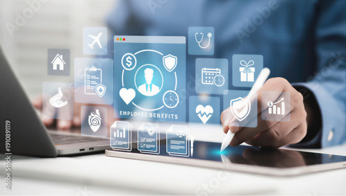 Person using digital tablet with employee benefits icons on screen in office setting