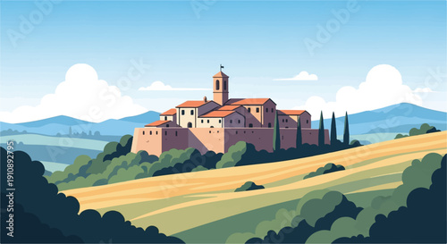 Picturesque village perched on a hill with fields and mountains in background