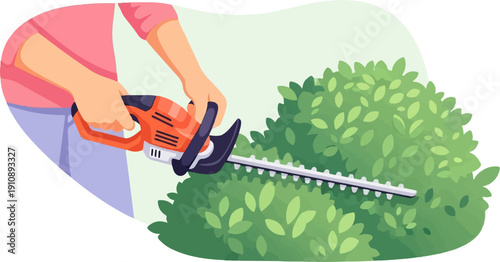 Person's hands trimming a dense green bush with an orange electric hedge trimmer