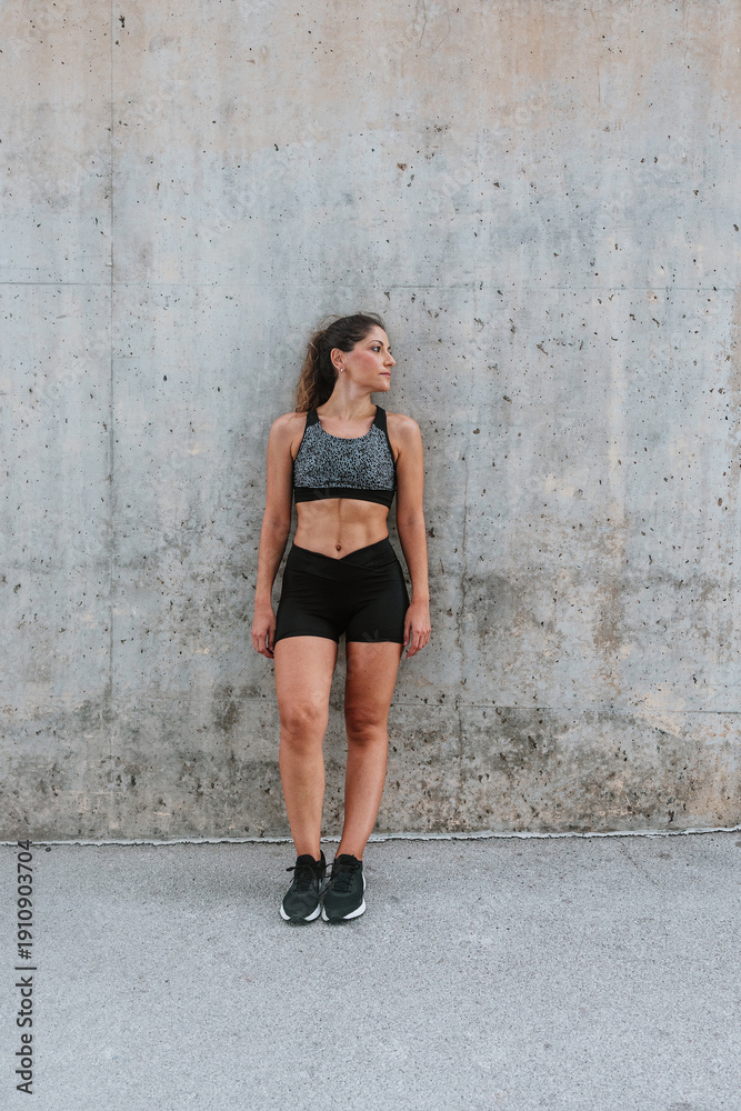 Fototapeta premium portrait of Young Hispanic woman in sportswear outdoors