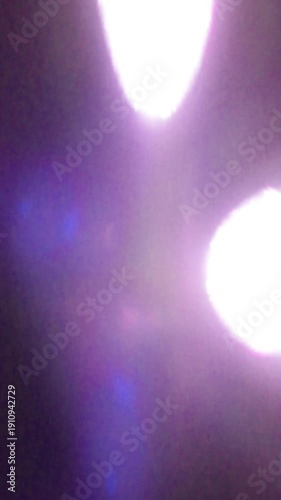 Dynamic Vertical Bokeh Light Flash Transition, Dynamic Neon Light Motion with Purple Glare and Blur Across Frame. best for fitness reel