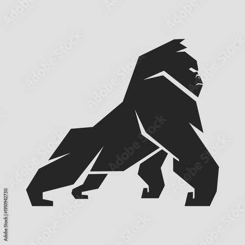 A powerful geometric silhouette of a walking gorilla. This stylized illustration captures the strength and dominance of the great ape using sharp, angular lines in a monochrome style