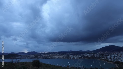 Timelapse footage of boats anchored under the clouds on a winter day in Gümbet Bay, a famous holiday resort in Bodrum.