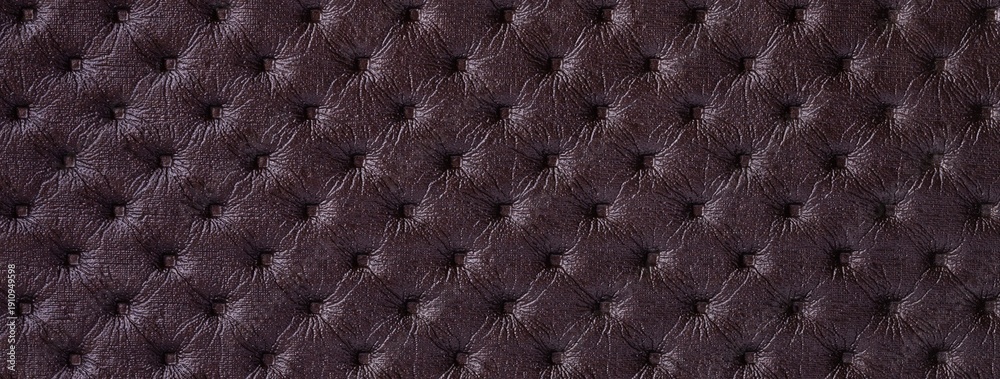 Obraz premium Dark purple leather texture with capitone pattern, macro background of brown retro Chesterfield vintage textile fabric