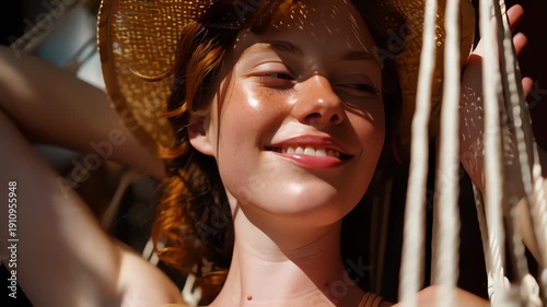 Woman in Straw Hat Smiling Freely.