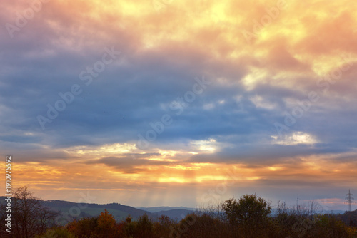Evening sunshine background with clouds dramatic sky.