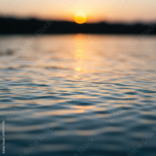 Gentle, blurred surface of tranquil water reflecting soft sunlight, creating a smooth, peaceful, and abstract minimalist background ,fluid ,gentle ,blue