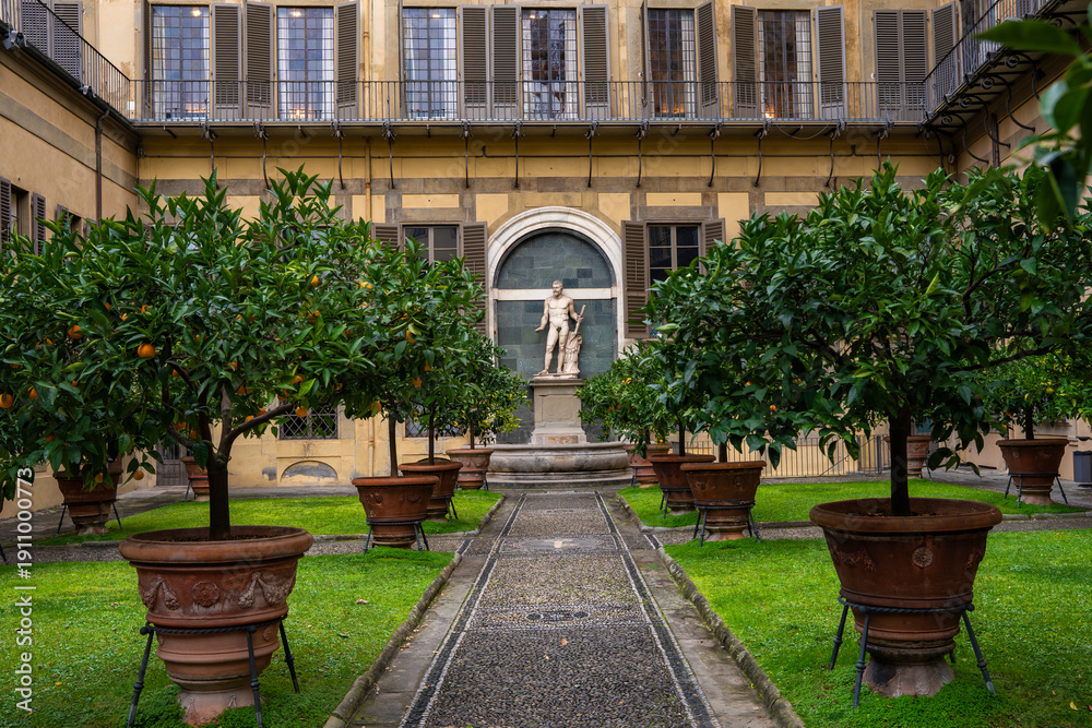 Obraz premium The courtyard garden of Palazzo Medici Riccardi in Florence, with sculptures and planted mandarin trees. Renaissance residence of the Medici family. Florence,Italy 04.01.2026 