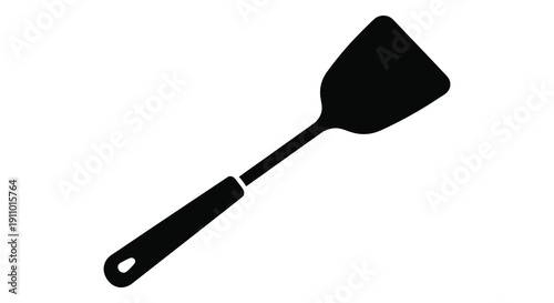 A simple black silhouette depicts a kitchen spatula angled diagonally against a plain white backdrop high quality professional