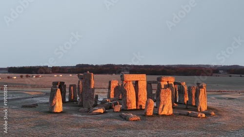 A drone view of snow-covered Stonehenge and the Wiltshire countryside in England, UK. The stone circle dates back to 3000 BC and is one of the most famous ancient wonders of the world and a UNESCO