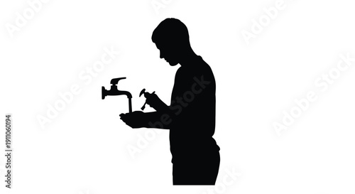 Silhouette of a man drinking water from a public fountain