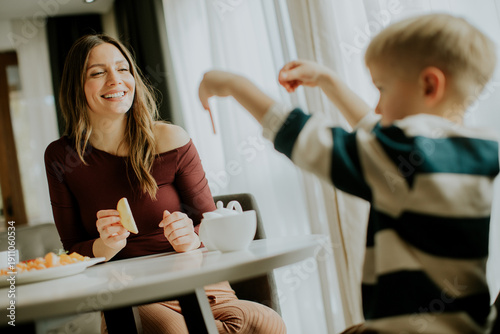 Woman and child enjoy snack...