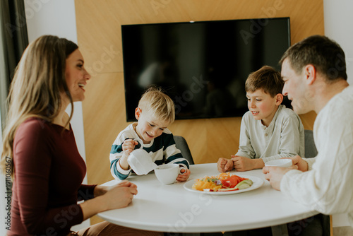Family enjoys breakfast tog...