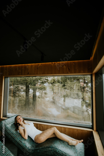 Woman lying on a warm stone...