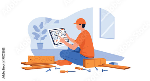 A man in an orange cap sits on the floor assembling furniture, viewing a floor plan on a tablet with tools.
