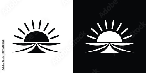 Sun rising over mountains in black and white rising sun