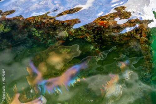 Obraz na plátně Water surface shows oil sheen over the USS Arizona Memorial at the Pearl Harbor