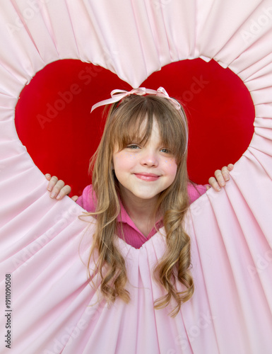 Wallpaper Mural Girl with blonde curls and bangs posing in pink and red Valentine's heart Torontodigital.ca