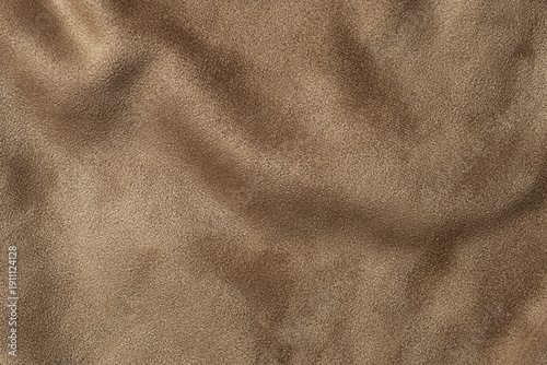 Foto Dark beige suede leather texture background, velvet fabric