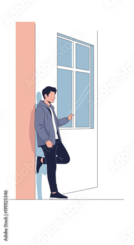 Modern Young Man Leaning Against Building Wall Next To Window Using Mobile Device