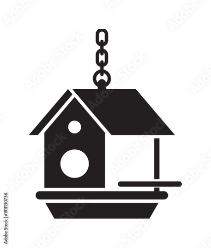 Black silhouette icon of a hanging bird feeder with a chain, perch, and seed tray, designed in a simple, minimalist graphic style for wildlife or gardening themes