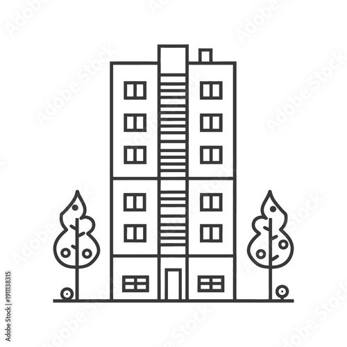 A tall apartment building with trees alongside on both sides