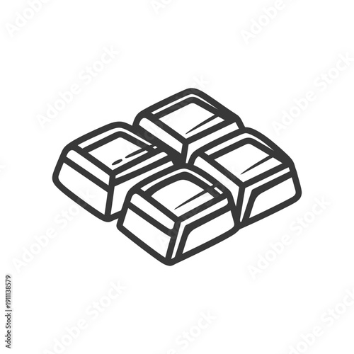 Four square pieces of what appears to be chocolate in a design