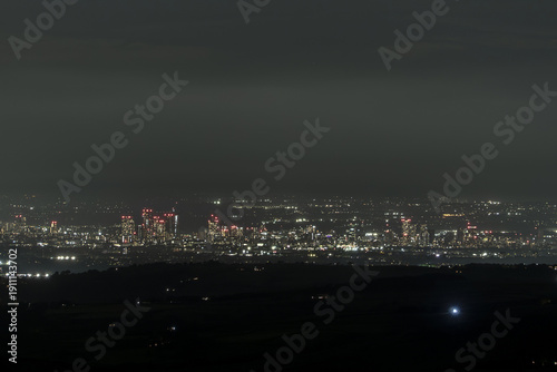 Manchester cityscape, viewed from miles away in the Peak District