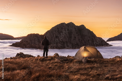 Incredible camping view witha  man on mountain in Snowdonia above the clouds