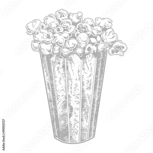 A tall container is filled to the brim with fluffy popcorn