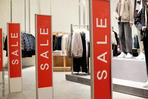 Bilde på lerret Red anti theft security gates at store entrance dressed in sale covers
