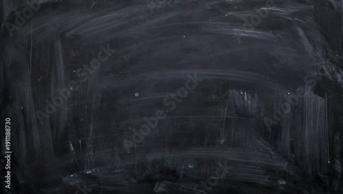 Dark chalkboard background with smeared chalk marks and a dirty surface