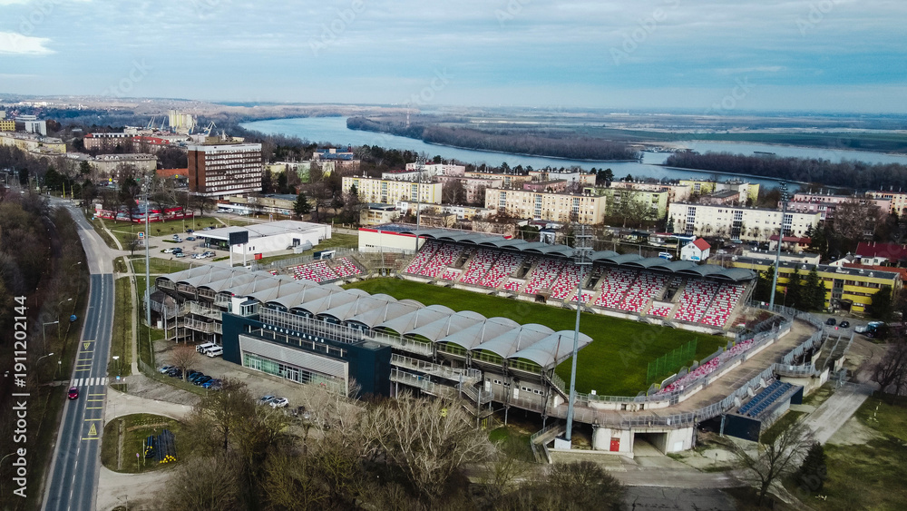 Fototapeta premium Aerial view of Dunaújváros industrial zone and steel plant with pipeline system in winter