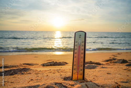 Thermometer on sunset sea beach in tropical. Extremely hot day. Thermometer measuring air temperature. Heat wave weather. Hot weather, drought. Abnormally temperature, extreme heat in Europe. Sunburn.