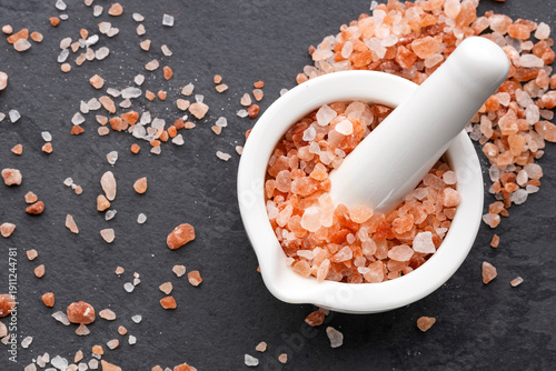 Coarse Himalayan pink salt in the mortar and spread on the slate